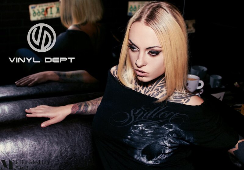 woman with tattoos and piercings