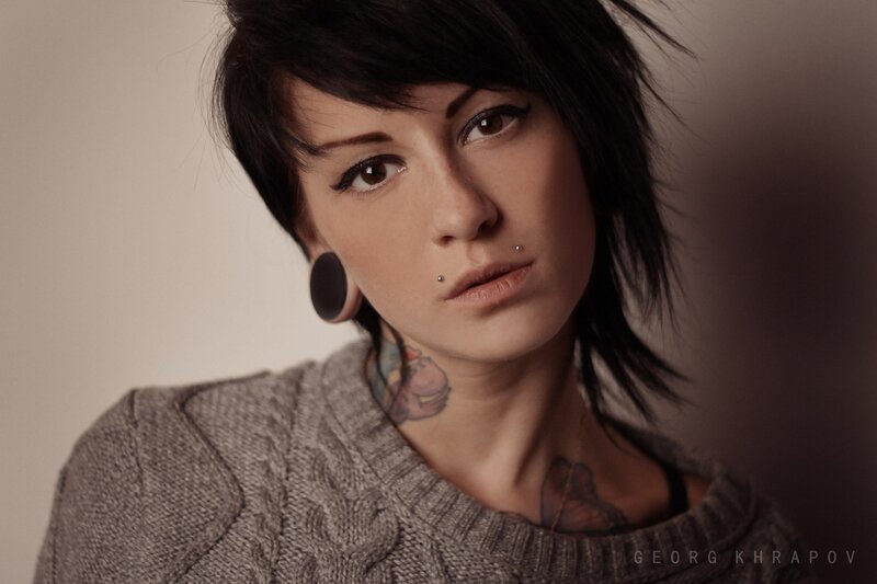 woman with tattoos and piercings
