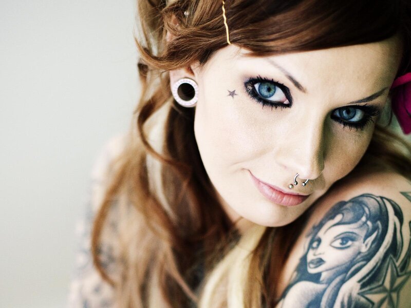 woman with tattoos and piercings