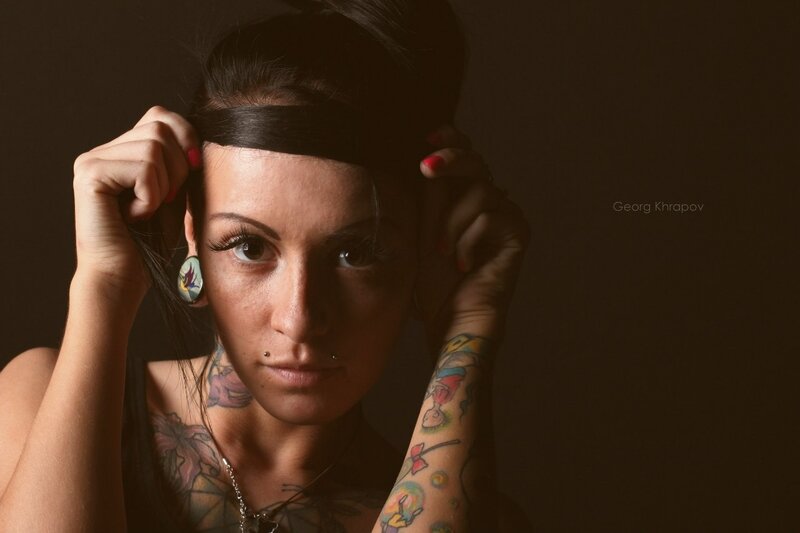woman with tattoos and piercings