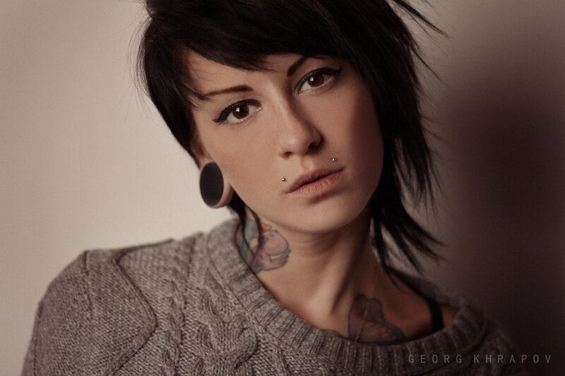 woman with tattoos and piercings