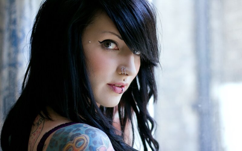 woman with tattoos and piercings