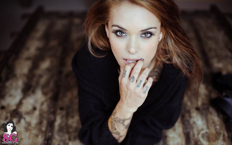 woman with tattoos and piercings