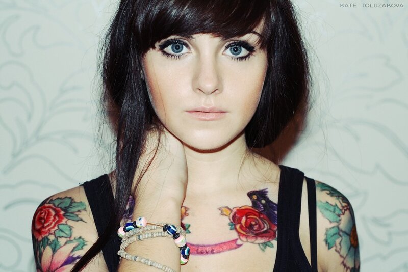 woman with tattoos and piercings