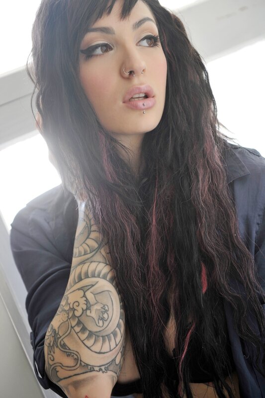 woman with tattoos and piercings