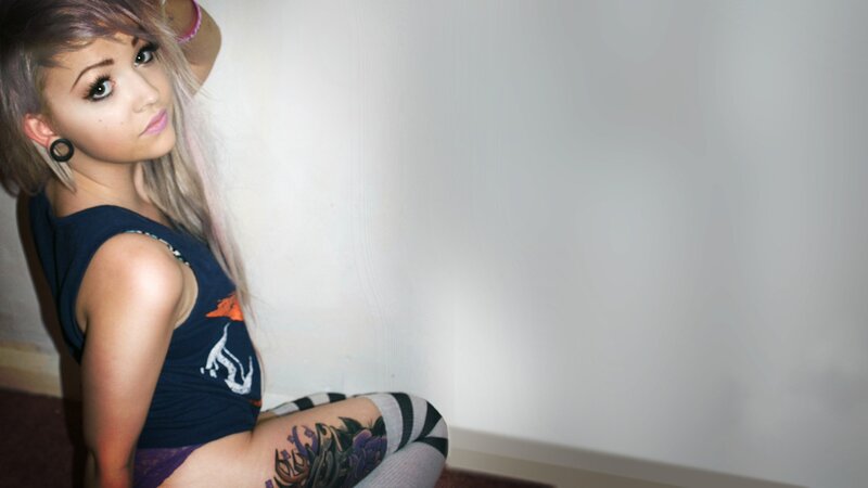 woman with tattoos and piercings