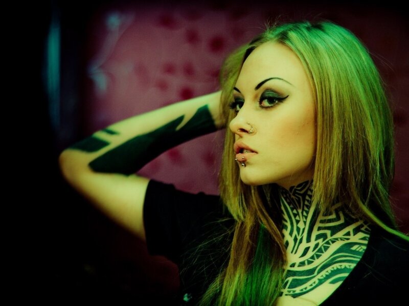 woman with tattoos and piercings