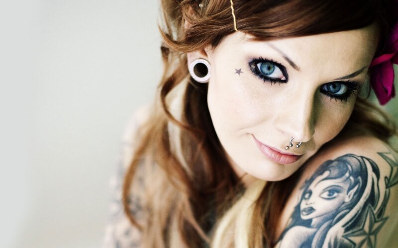 woman with tattoos and piercings