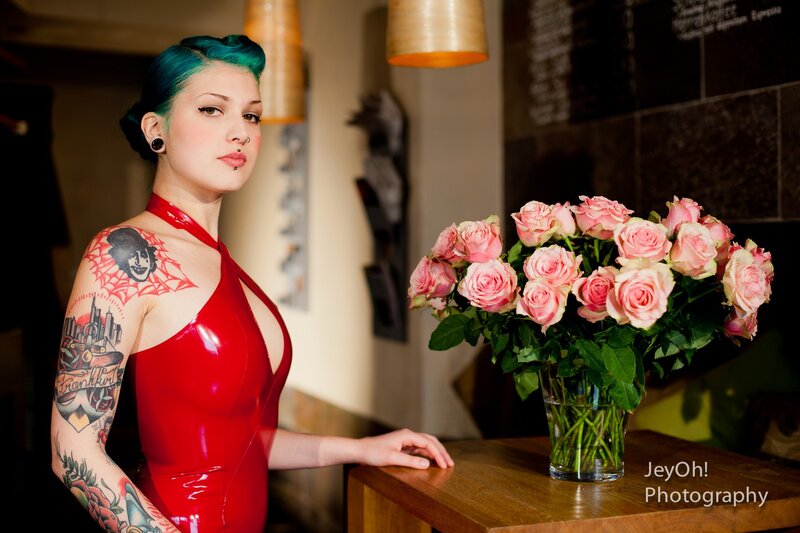 Woman with tattoos and pink roses