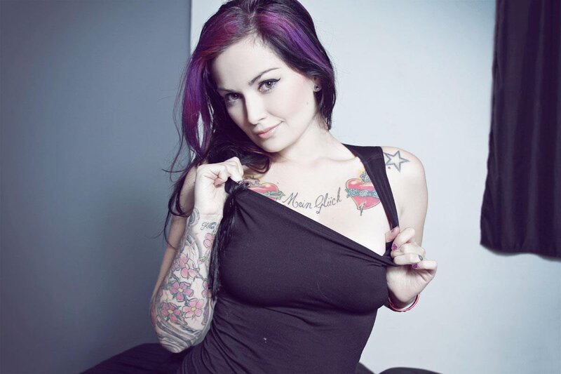woman with tattoos and purple hair