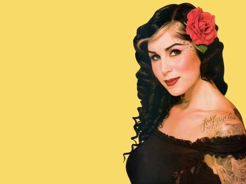 woman with tattoos and rose