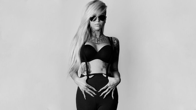 woman with tattoos and sunglasses