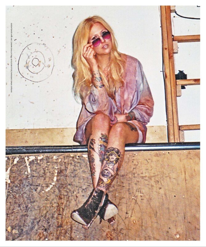 woman with tattoos and sunglasses