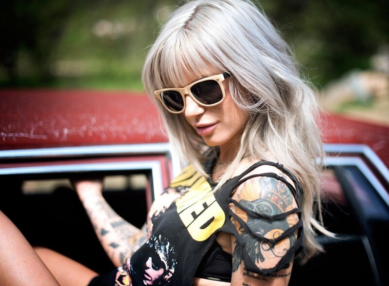 woman with tattoos and sunglasses