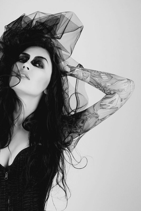 woman with tattoos and veil
