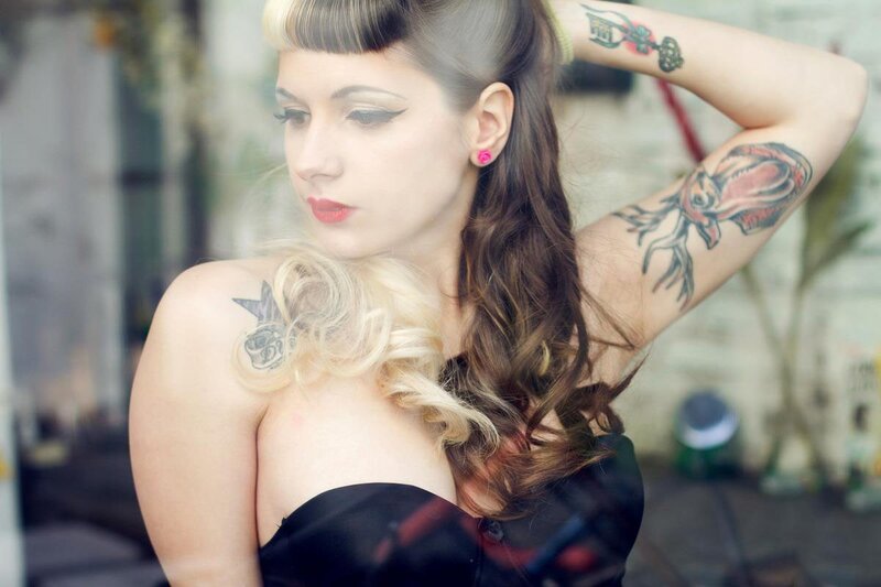 woman with tattoos and vintage style