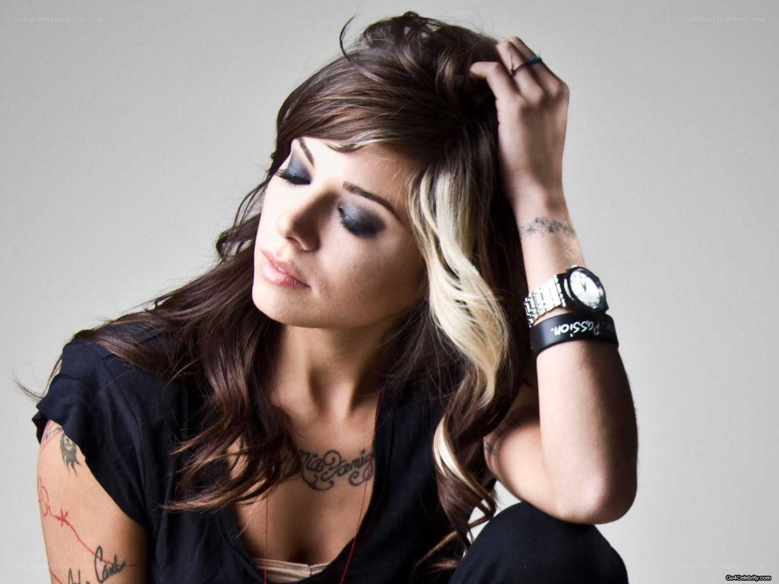 woman with tattoos and watch