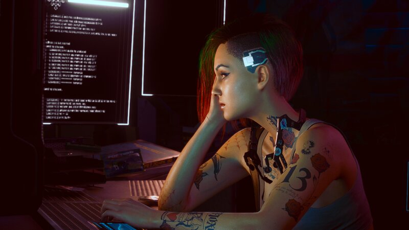 Woman with Tattoos at Computer