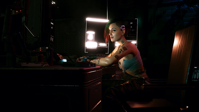 Woman with Tattoos at Desk — Black, Dark, Futuristic