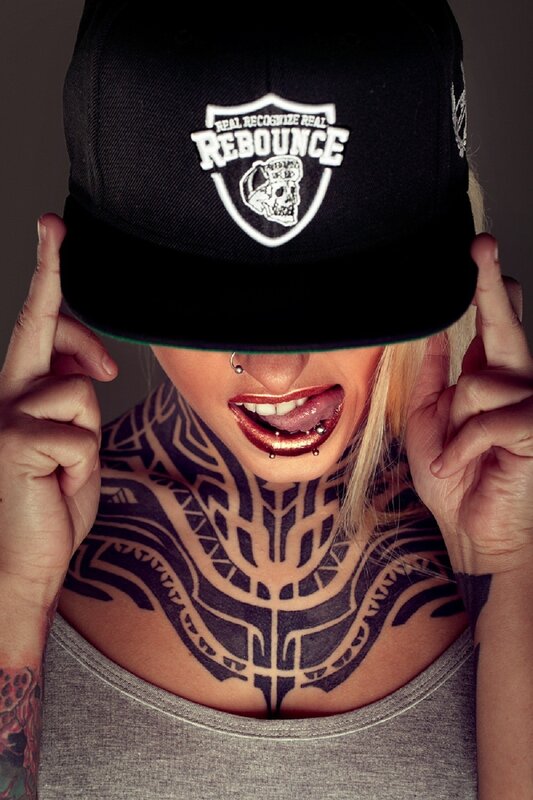 Woman with Tattoos — Black, Dramatic, Photograph, Hat, Lip Piercing