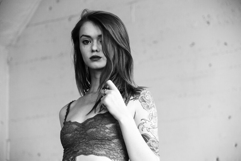 Woman with Tattoos — Black, Serious, Photograph, Lace Top