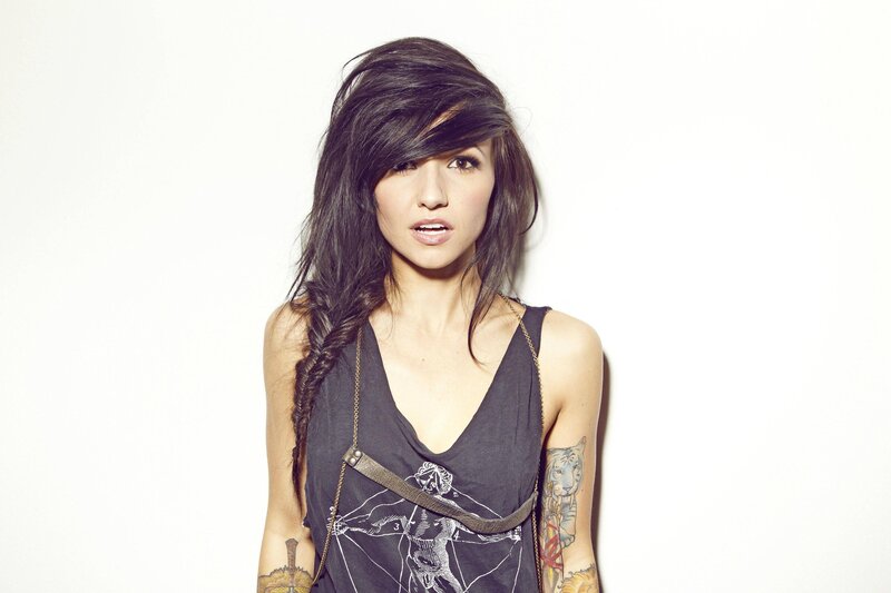 Woman with Tattoos — Braided Hair