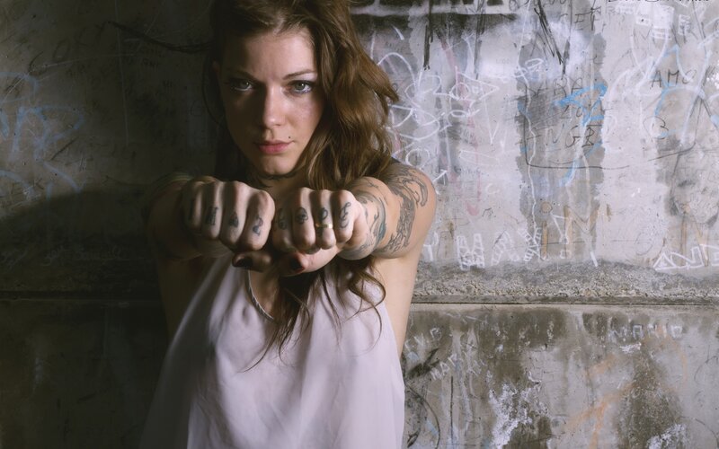 Woman with Tattoos — Gray, Intense, Photograph, Graffiti Wall