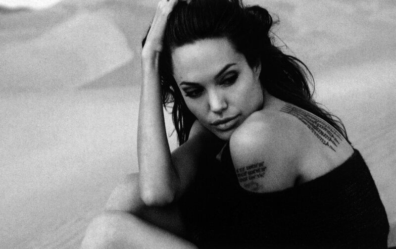woman with tattoos in black and white
