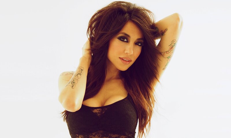woman with tattoos in black lace
