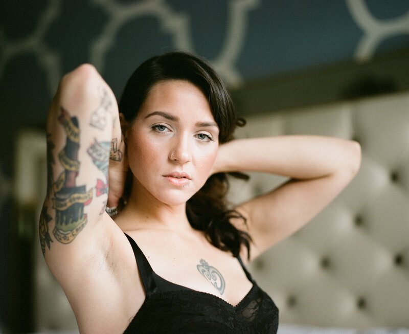 woman with tattoos in black lingerie