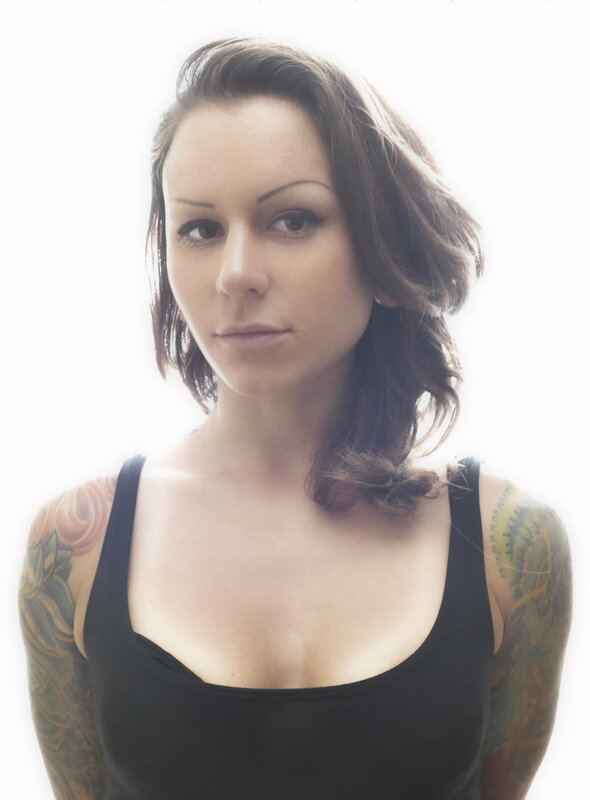 woman with tattoos in black top