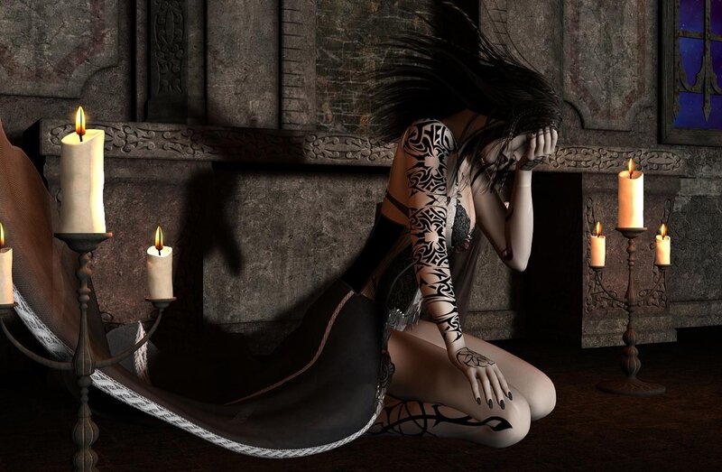 woman with tattoos in candlelight