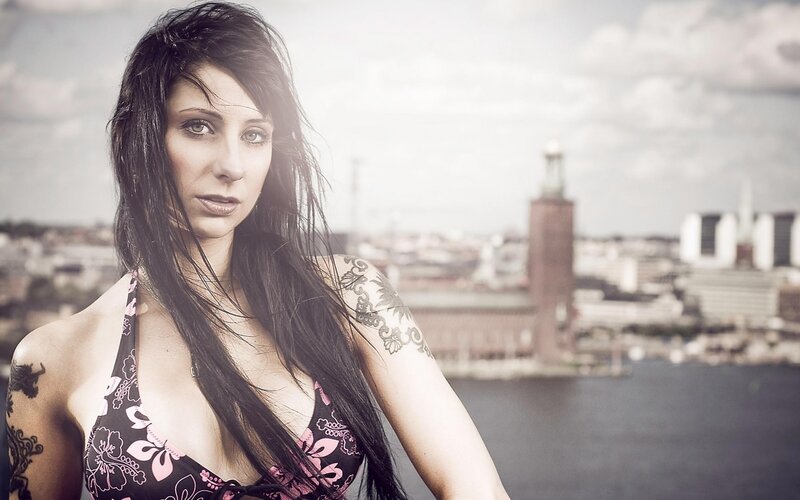 woman with tattoos in city
