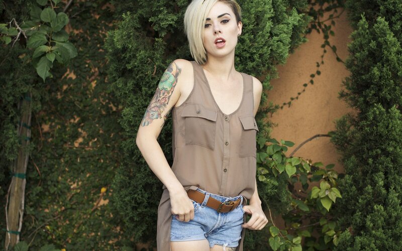 woman with tattoos in garden
