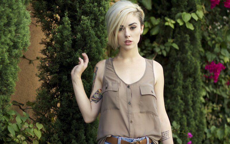 woman with tattoos in garden