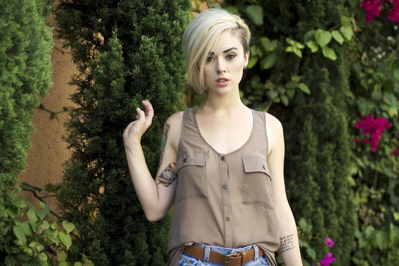 woman with tattoos in garden