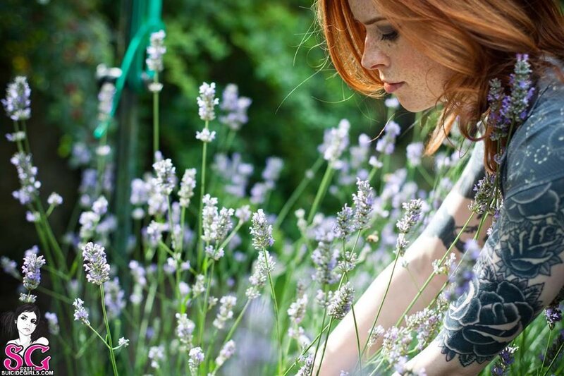 woman with tattoos in lavender garden