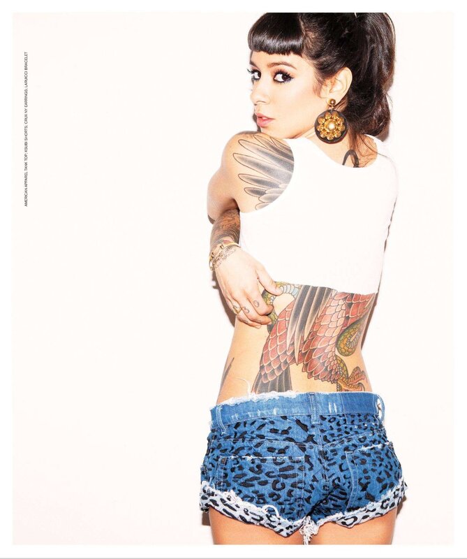 woman with tattoos in leopard shorts