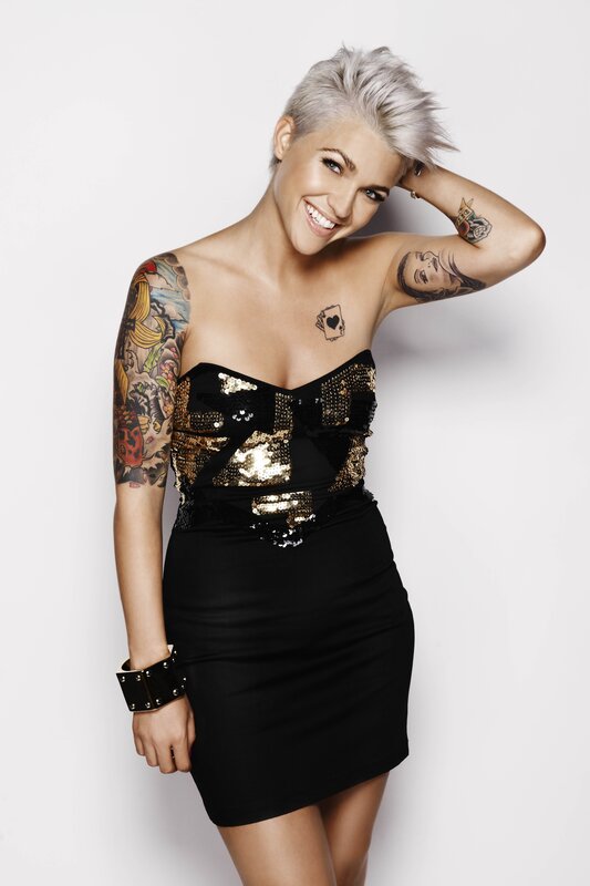 woman with tattoos in sequin dress