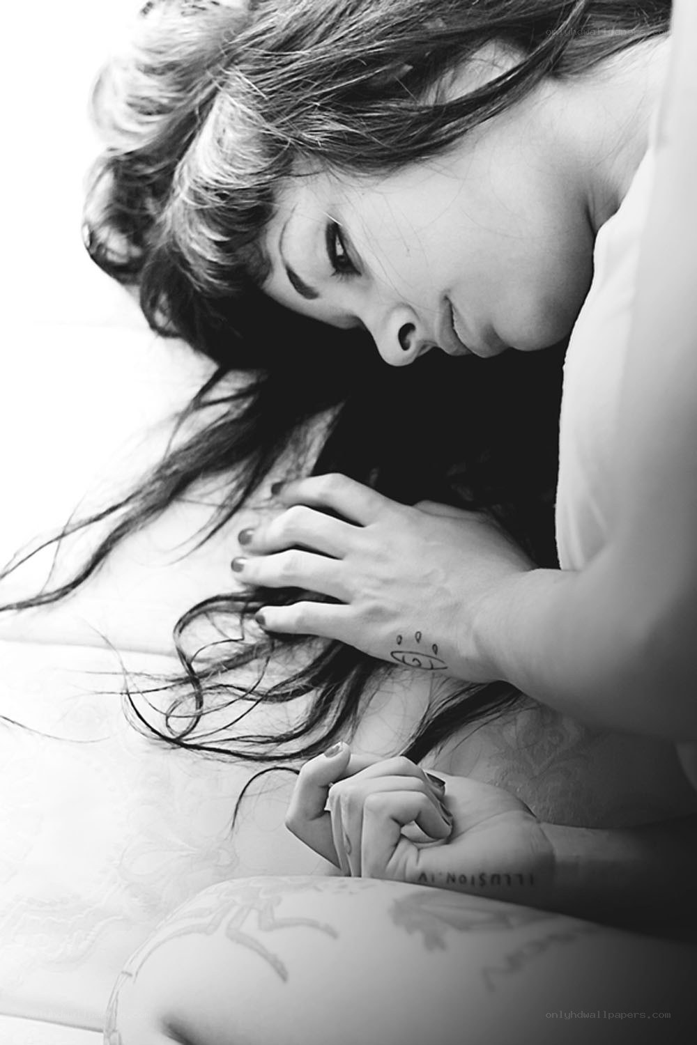 woman with tattoos lying down