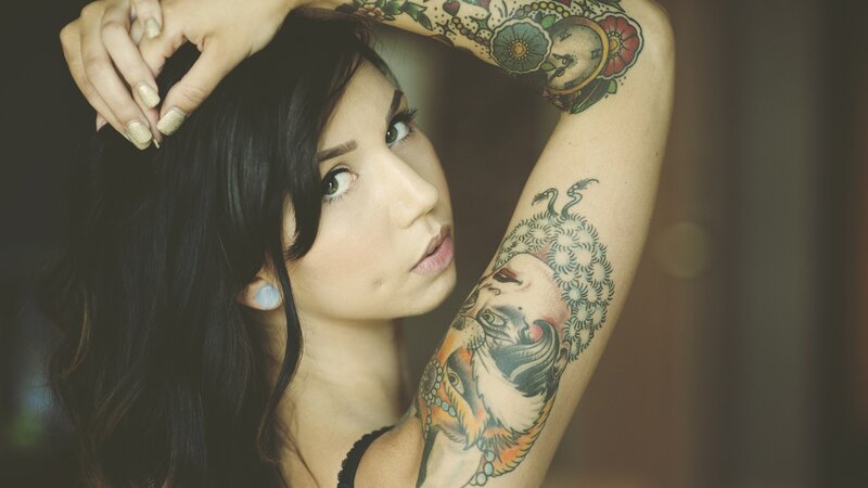woman with tattoos on arm