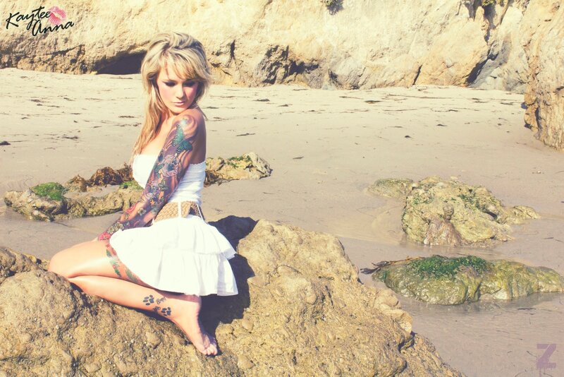 Woman with tattoos on beach