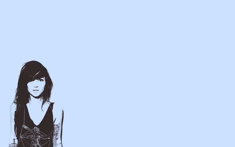 woman with tattoos on blue background