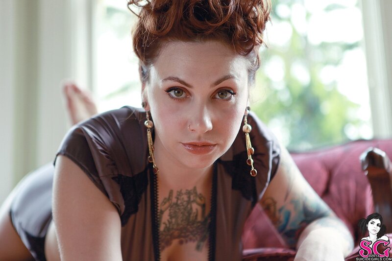 Woman with Tattoos on Couch — Brown, Calm