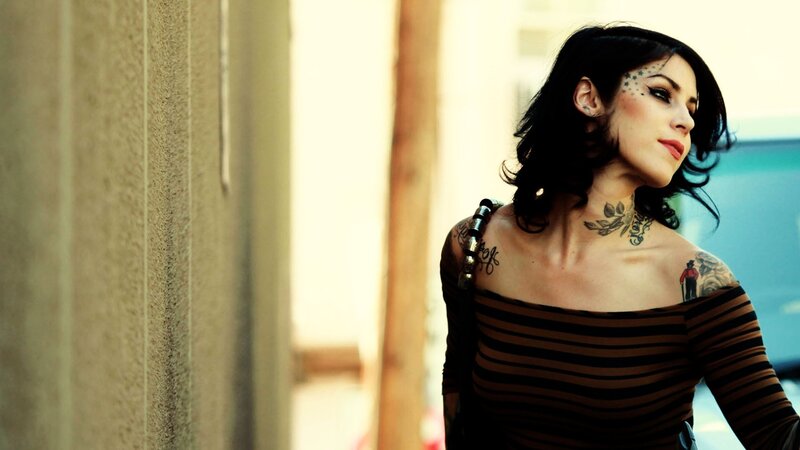 woman with tattoos on street