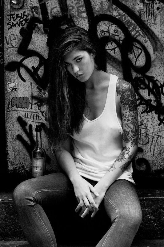 woman with tattoos on street