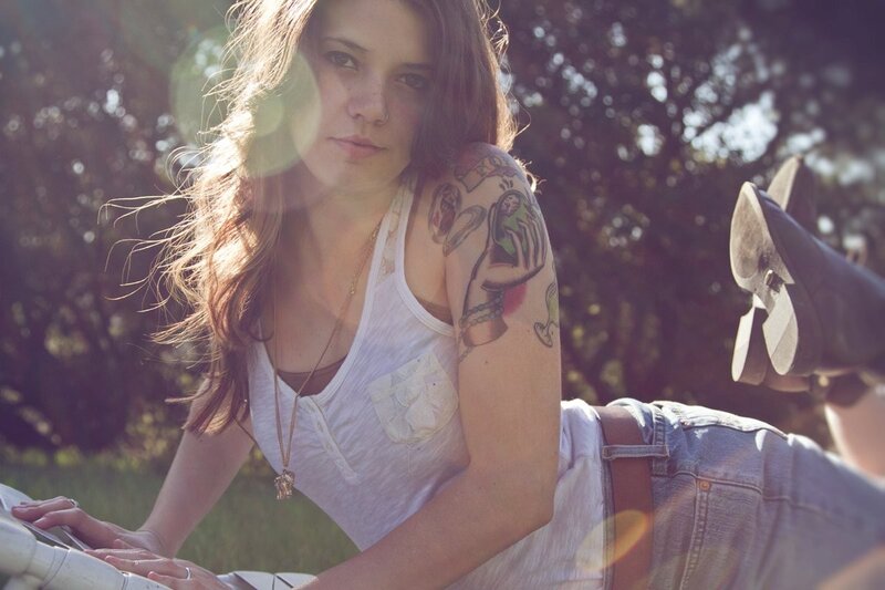 woman with tattoos outdoors