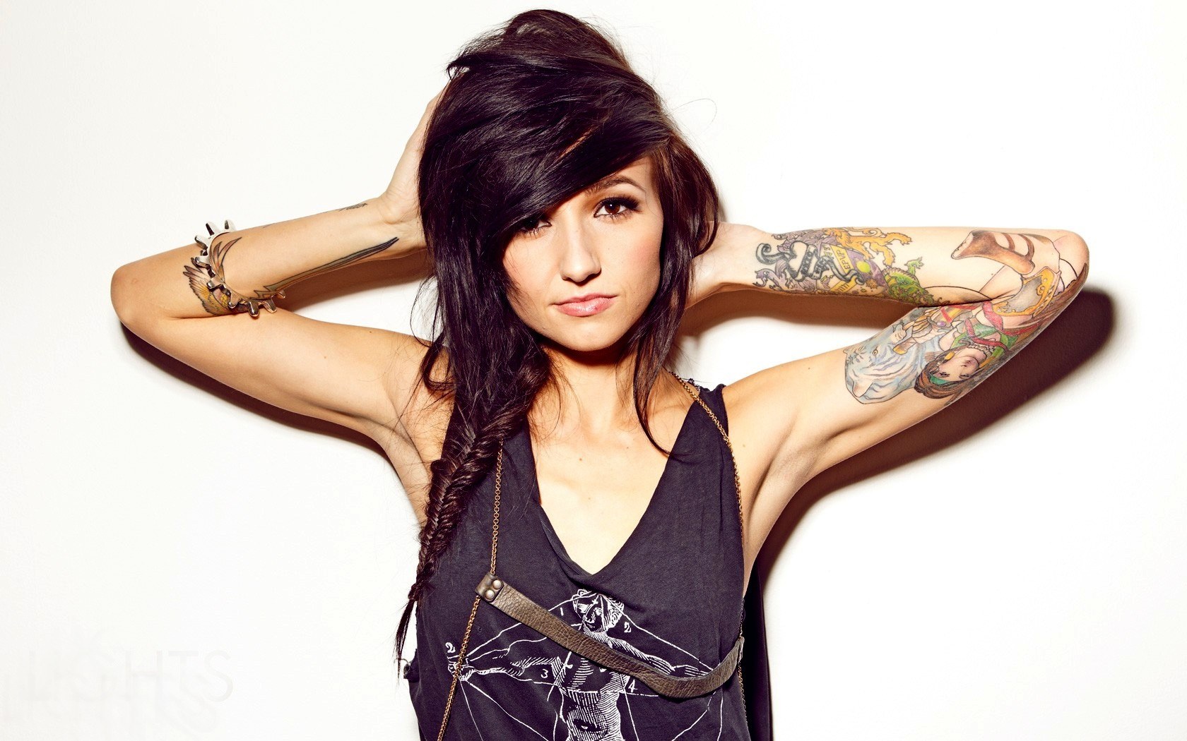 woman with tattoos posing