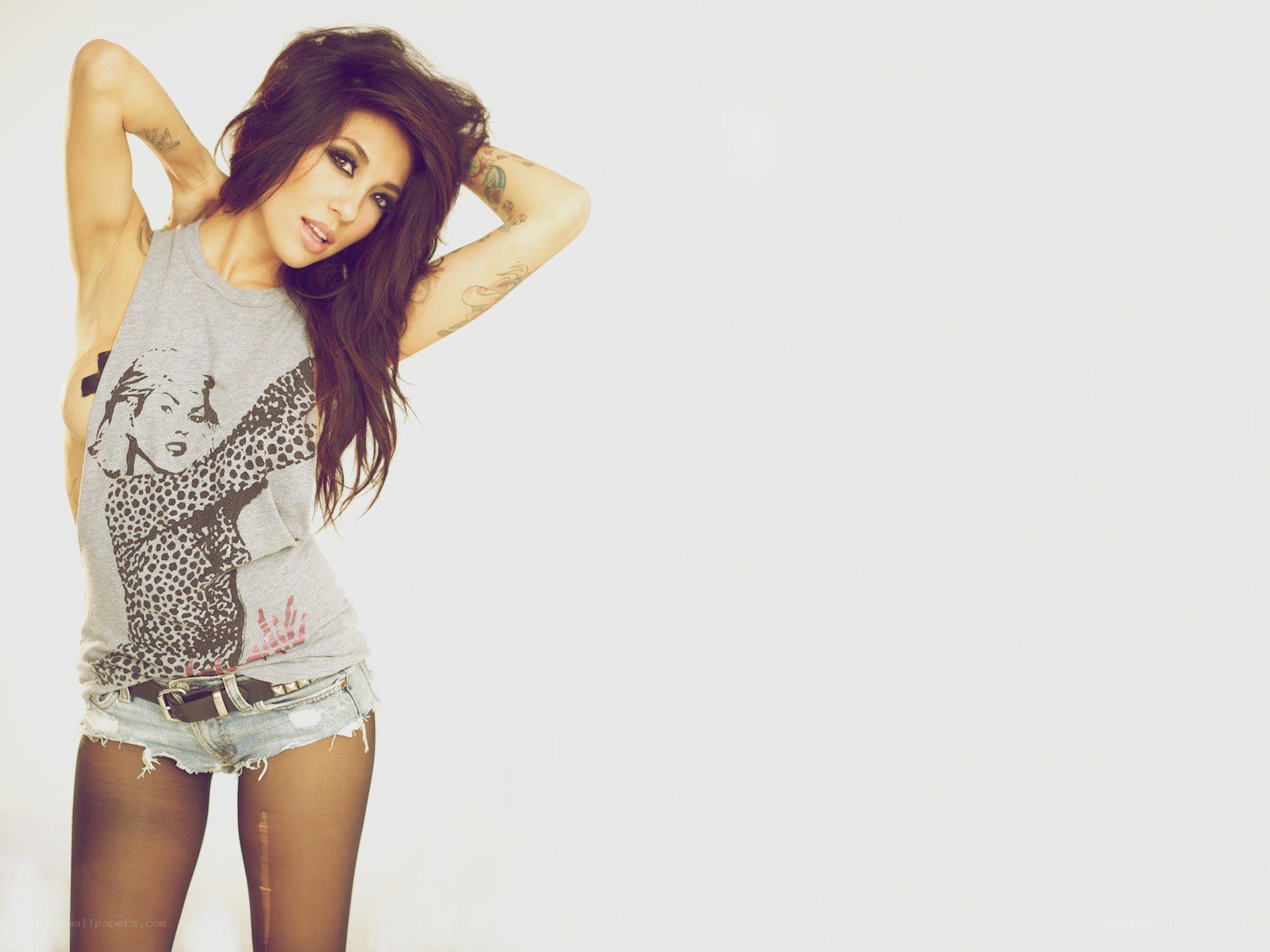 woman with tattoos posing