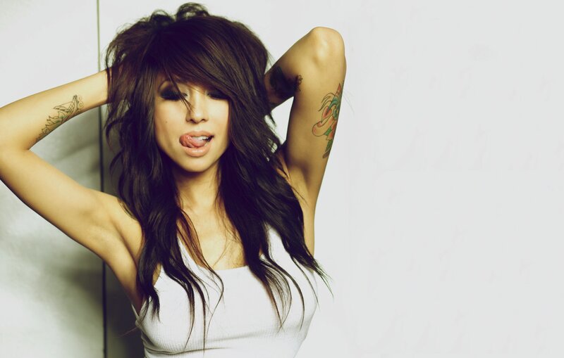 woman with tattoos posing
